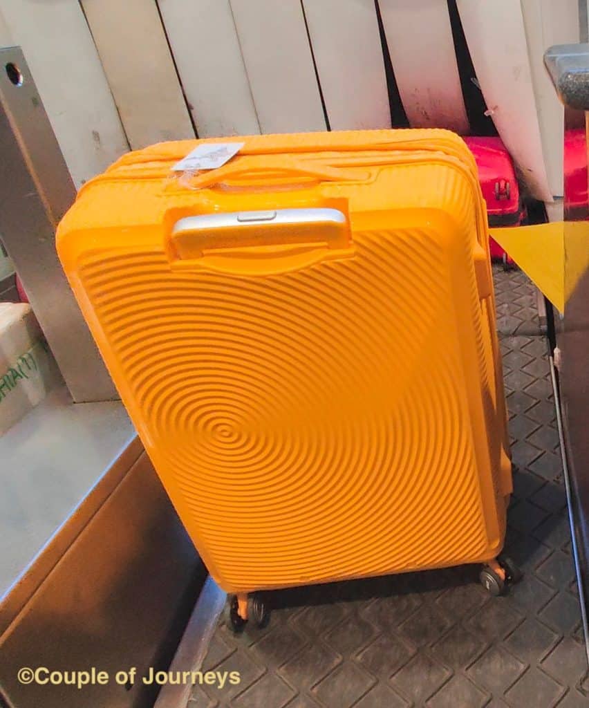 American tourister luggage - Curio in yellow