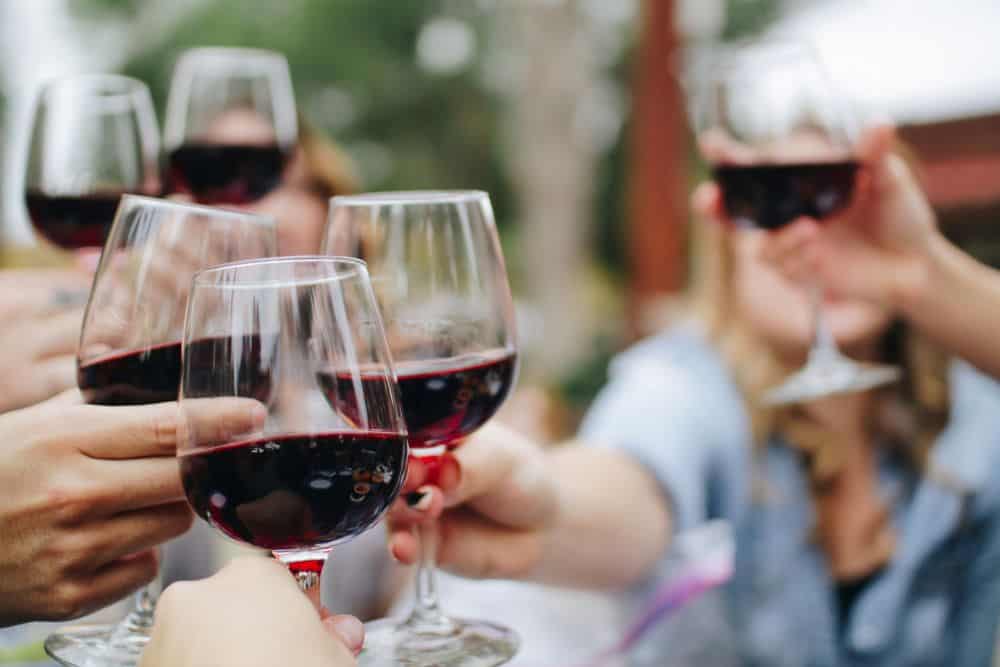 Enjoy and glass of wine while you soak in the beauty of Queenstown, New Zealand. 
