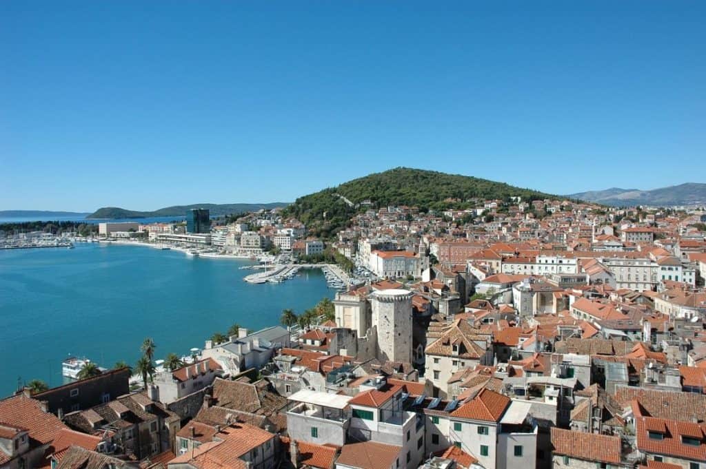  A panoramic aerial view of Split from Marjan Hill, displaying the city’s terracotta rooftops, blue Adriatic waters, and surrounding green hills. This scenic lookout is a must-see on a Croatia Summer Itinerary, perfect for photography and hiking