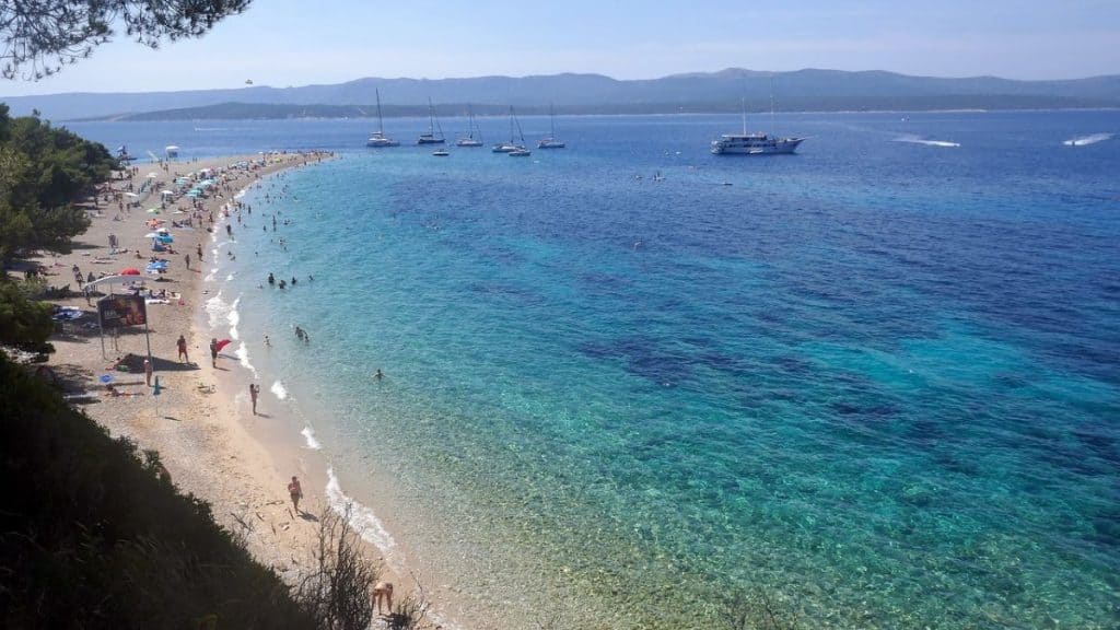he iconic Zlatni Rat beach, with its distinctive horn-shaped stretch of white pebbles reaching into the Adriatic, is a top highlight among Croatia travel beaches."