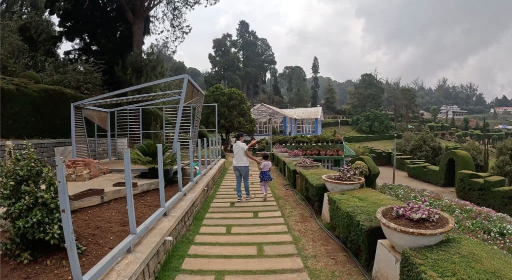 A picture of me and my daughter together in the Horticulture garden, Ooty